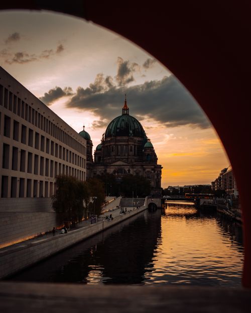 Free Stunning view of Berlin Cathedral and the Humboldt Forum at sunset reflecting on the river. Stock Photo