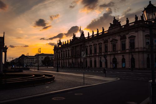 Free A stunning sunset view over historic architecture in Berlin, Germany, capturing dramatic skies. Stock Photo