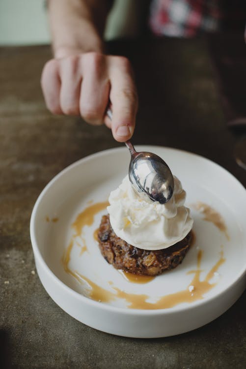 Person Holding Stainless Steel Spoon 