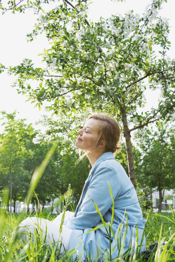 A person taking a slow breath outdoors before the working day. Photo by Ksenia Chernaya on Pexels.
