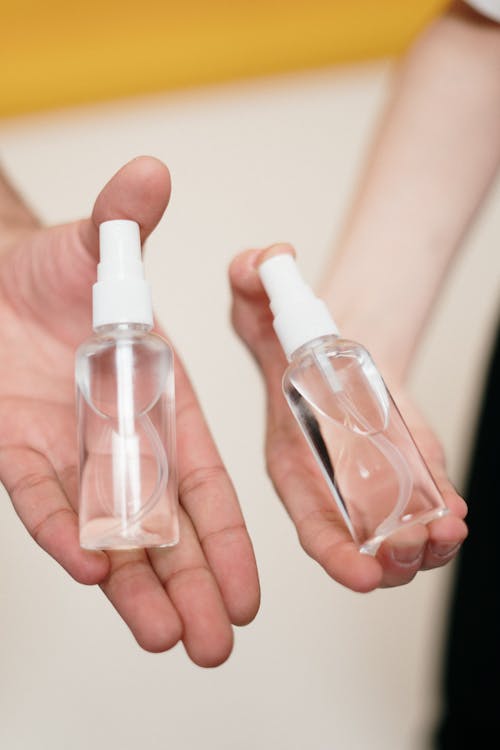 Free Person Holding Clear Glass Bottle Stock Photo
