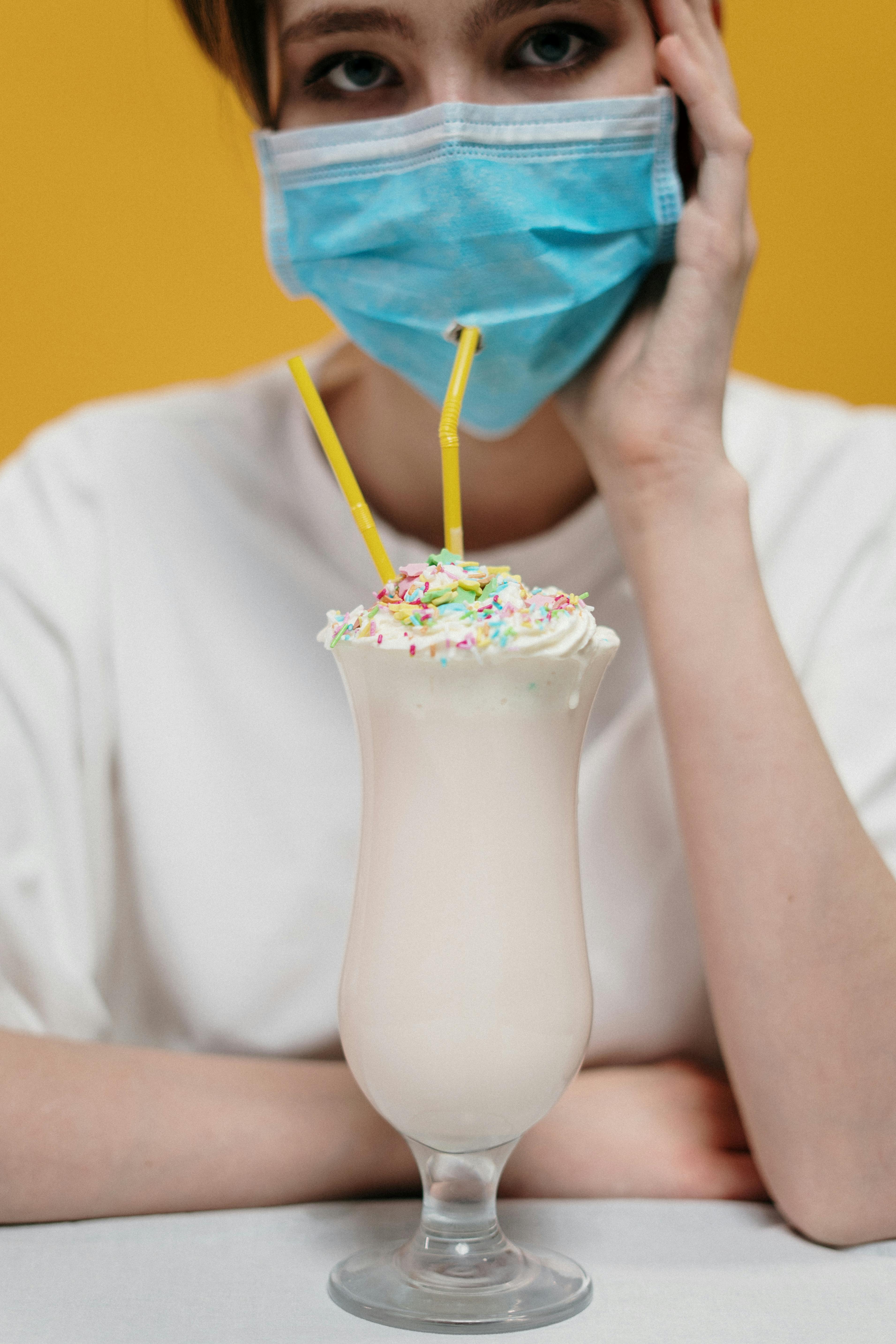 woman drinking milkshake