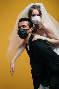A couple in wedding attire wearing masks, symbolizing love during pandemic.
