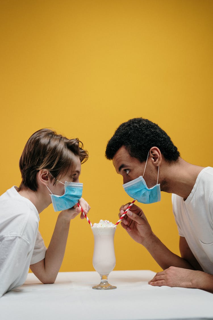 Man And Woman Drinking Milkshake