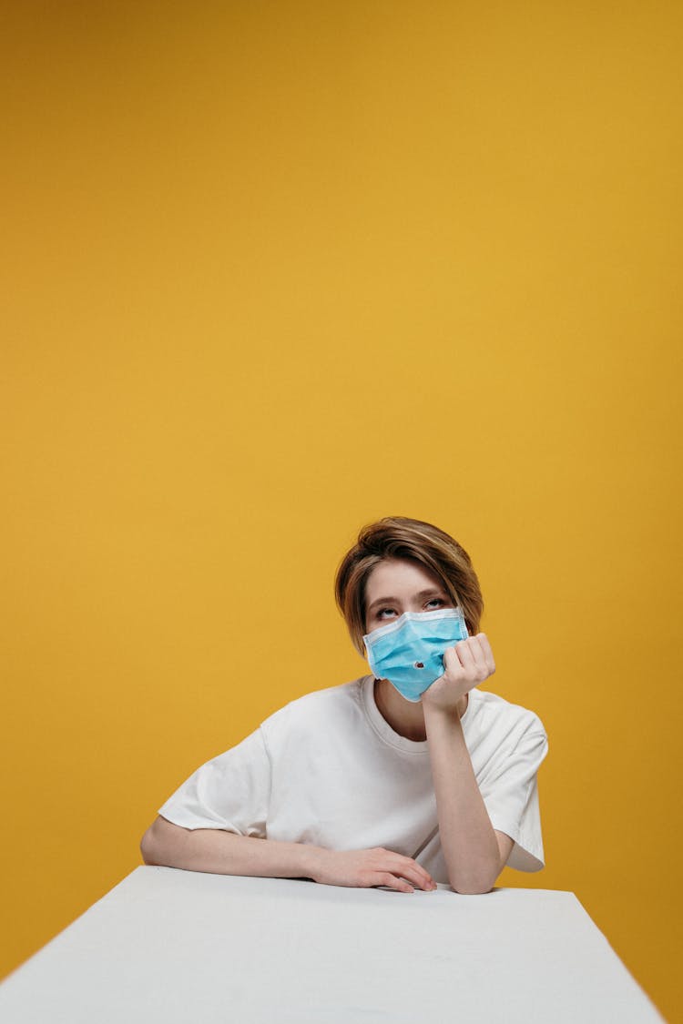 Woman In White Crew Neck T-shirt Wearing Face Mask