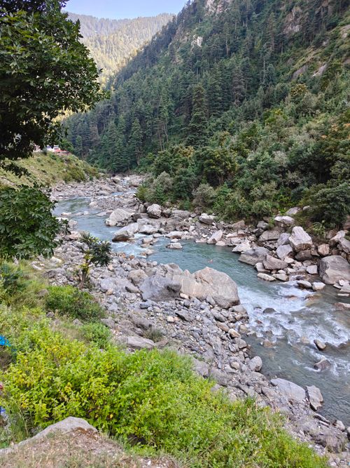 Free Beautiful river flowing through lush green valley in Balakot, Khyber Pakhtunkhwa. Stock Photo