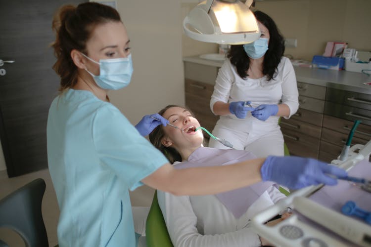 Woman In Light Blue Scrub Suit