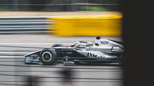 Free Dynamic shot of a Formula One car racing at Circuit de Spa-Francorchamps, Stavelot. Stock Photo