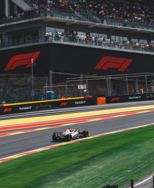 Free High-speed action of a Formula 1 car racing at Stavelot circuit in Belgium, capturing the thrill and energy of motorsports. Stock Photo