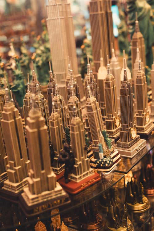 Free Collection of Empire State Building miniatures in a souvenir shop, showcasing New York's iconic architecture. Stock Photo