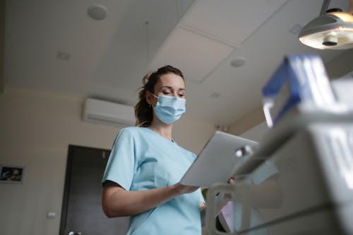 Free Photo Of Woman Wearing A Surgical Mask Stock Photo