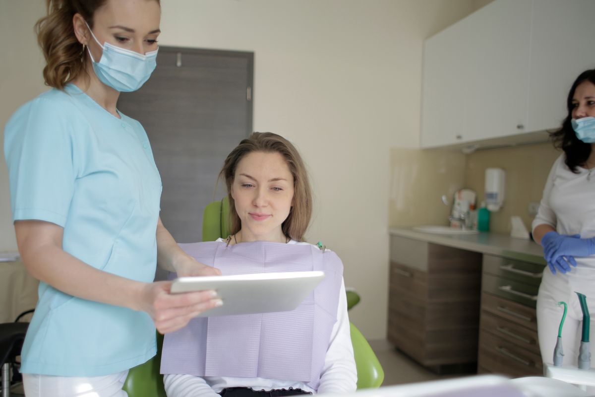 Dentist discussing a treatment plan in a modern dental office