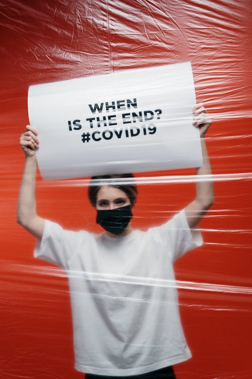 Free Woman Holding A Poster With Anxiety Stock Photo