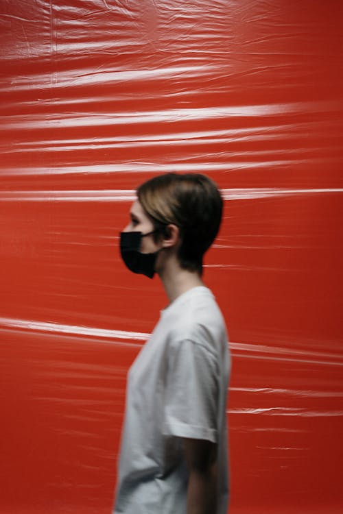 Free Side View Of A Woman With Face Mask Stock Photo