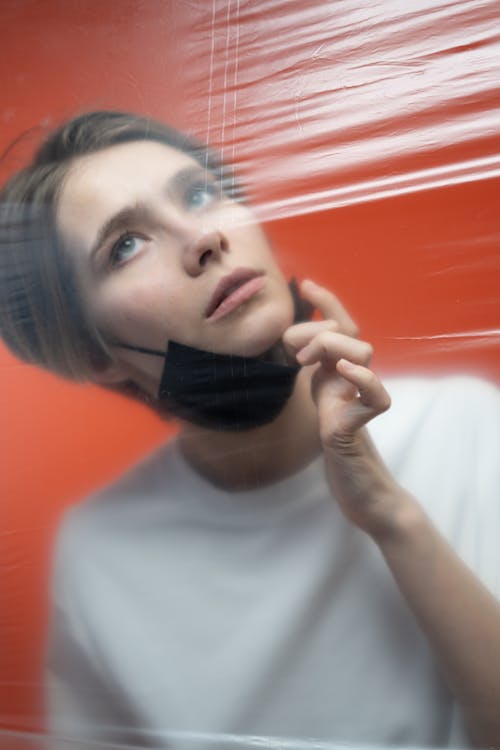 Free Woman With Face Mask Looking Worried Stock Photo