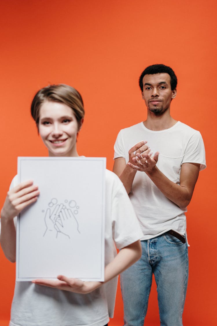 Woman Holding A Poster On Proper Handwashing