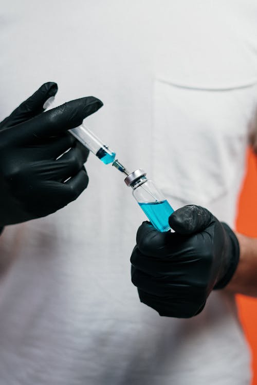 Free Person Holding A Vaccine Stock Photo