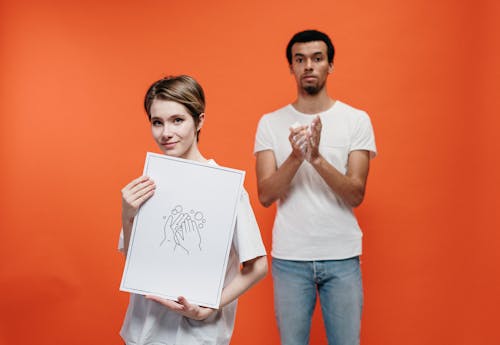 Woman Holding A Poster On Proper Hand Washing