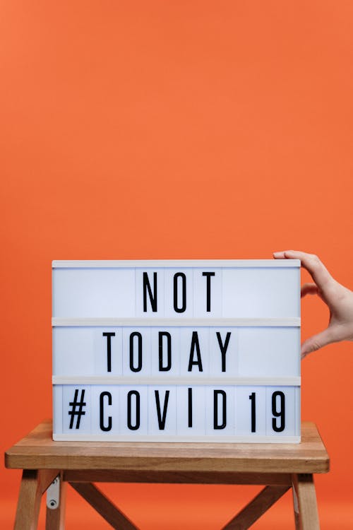Free Not Today Covid19 Sign On Wooden Stool Stock Photo
