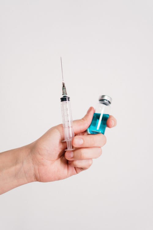 Free Person Holding A Vaccine  Stock Photo