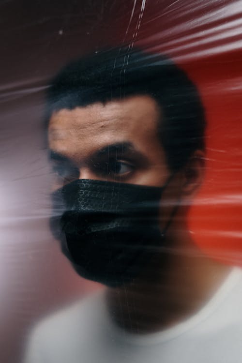Free Man Wearing A Black Face Mask  Stock Photo