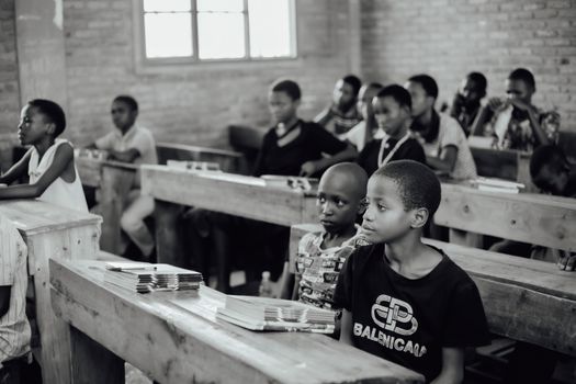 A group of attentive students in a classroom setting, focusing on their lessons.