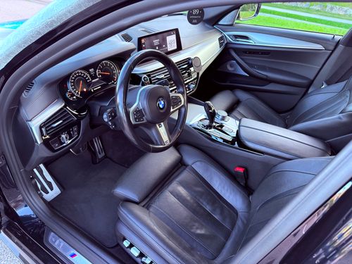 Free Explore the sleek and elegant interior of a luxury car featuring advanced dashboard technology. Stock Photo