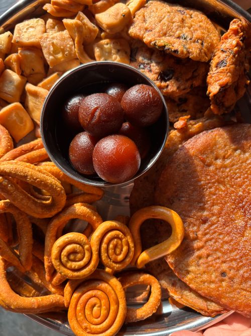 Free Top view of traditional Indian sweets and snacks on a tray, perfect for festive occasions. Stock Photo