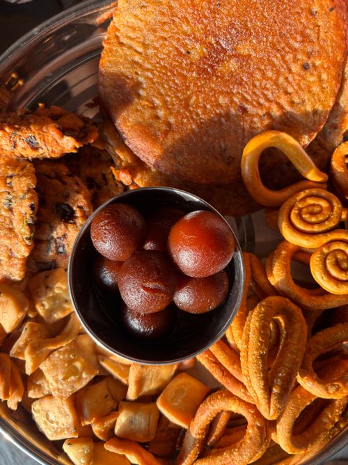 Free A vibrant assortment of traditional Indian sweets and savory snacks in a bowl, perfect for festive occasions. Stock Photo