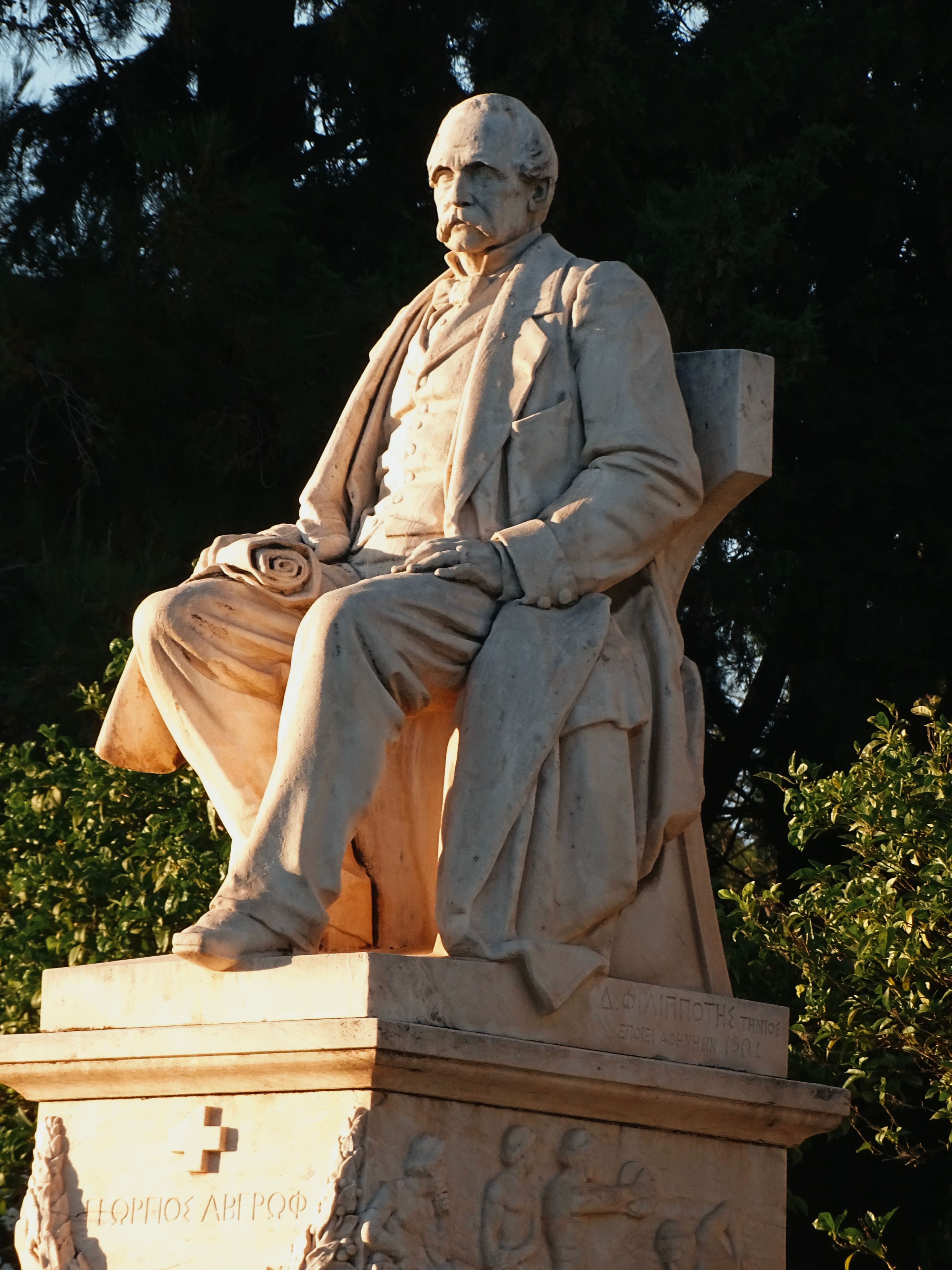 Marble statue of a historical figure in Athens, Greece, highlighting cultural heritage.