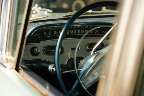Free Vintage car dashboard with classic speedometer and dials, showcasing retro automotive design. Stock Photo