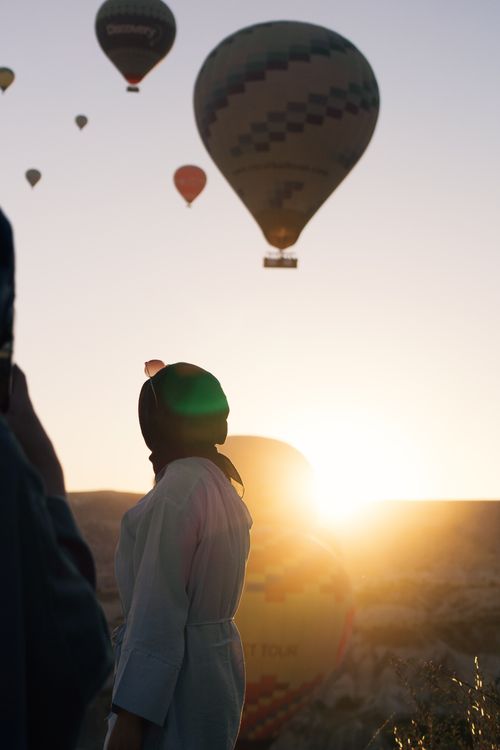 Free A captivating view of hot air balloons rising at sunrise in Cappadocia, Türkiye. Stock Photo