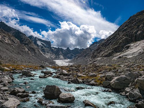 Free Scenic mountain river flowing through Bregaglia, Graubünden, Switzerland. Stock Photo