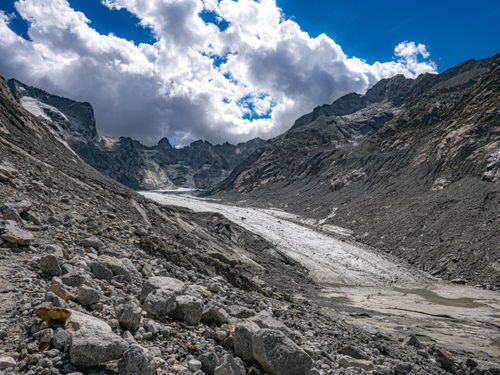 Free Stunning view of Bregaglia Valley's rugged alpine terrain under dramatic clouds. Stock Photo