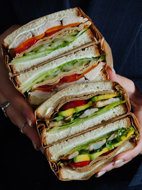 Free Close-up of fresh vegetable and chicken sandwiches showcasing vibrant ingredients. Stock Photo