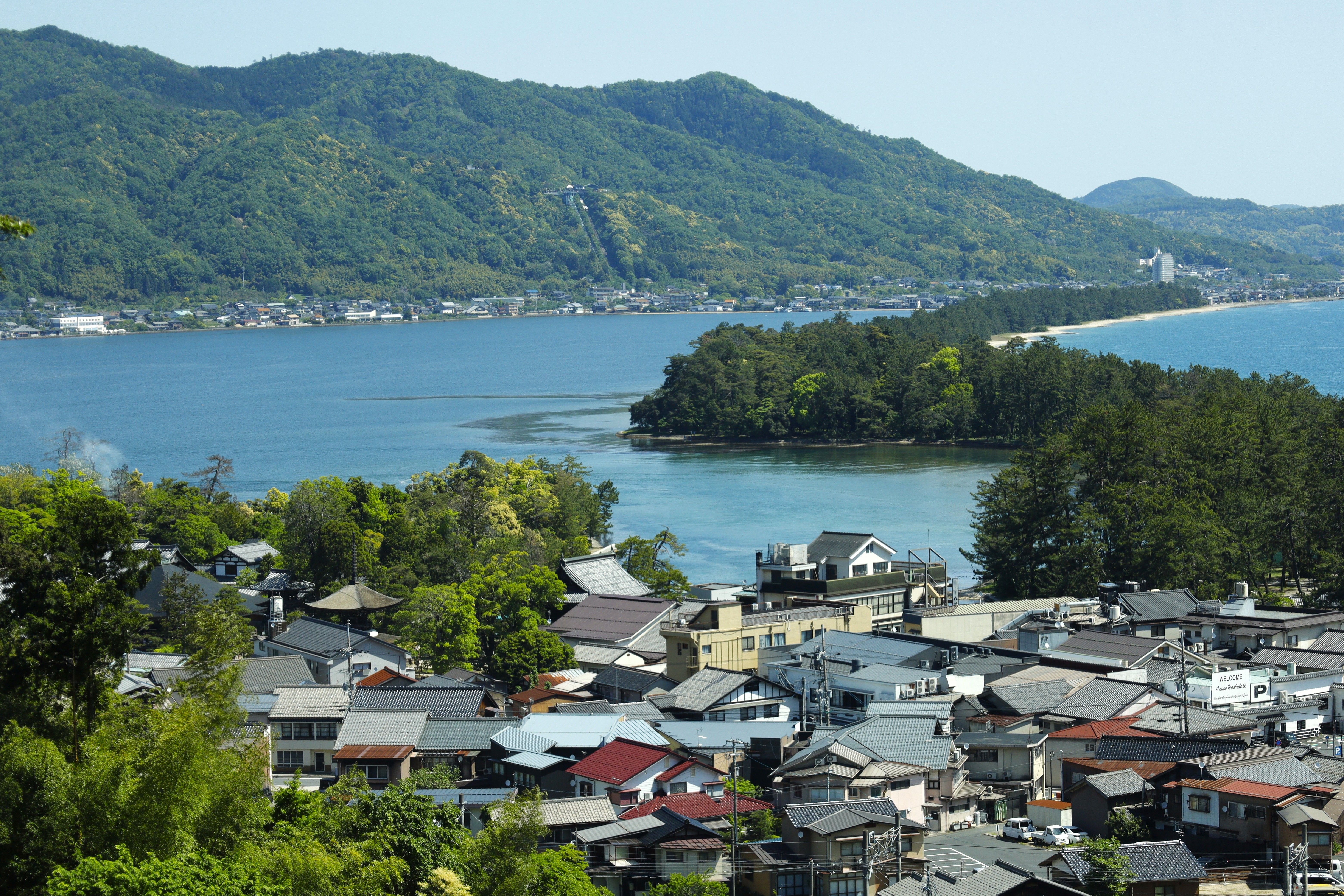 Explore the breathtaking landscape of Amanohashidate in Miyazu, Kyoto, with coastal and mountainous vistas.