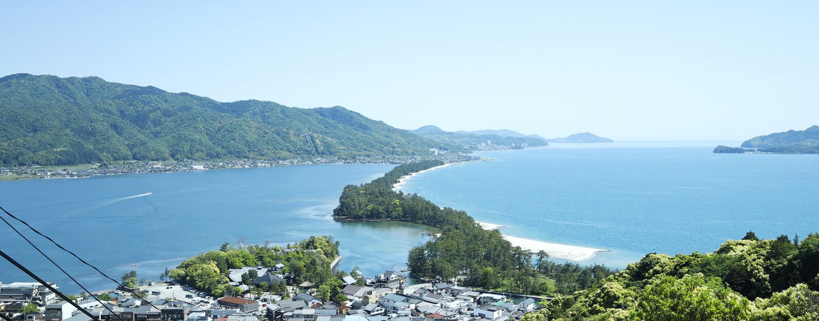 Explore the breathtaking Amanohashidate sandbar and lush landscapes in Miyazu, Kyoto, Japan.