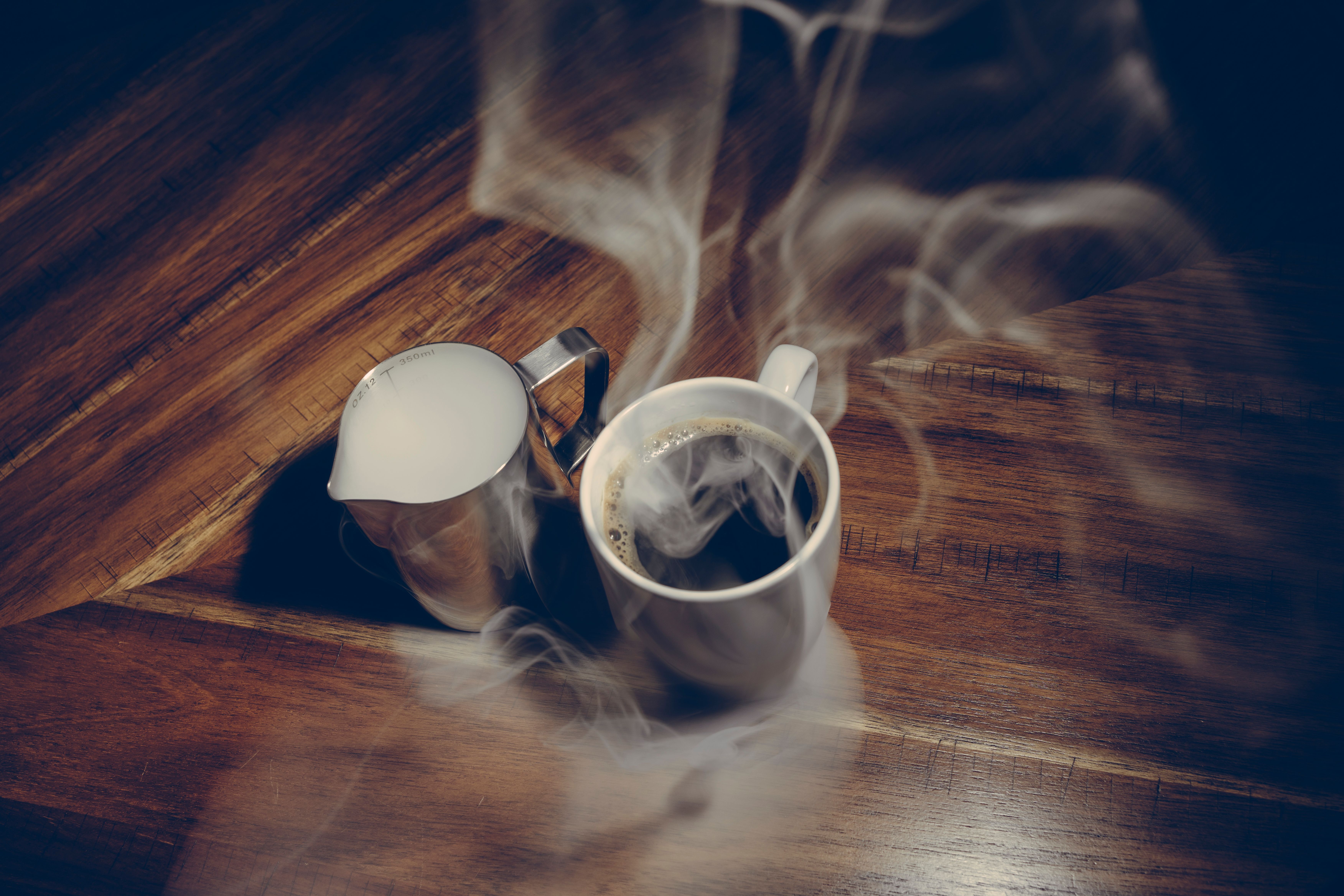 minimalist kitchen counter with warm morning light and coffee steam