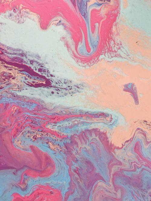 Free Colorful abstract fluid marbled art with swirling pastel hues of pink and blue. Stock Photo