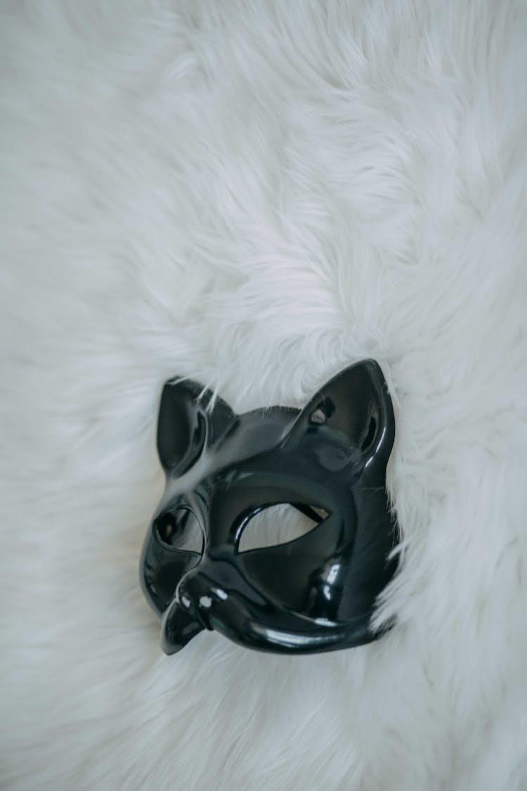 Black Animal Mask On White Fur