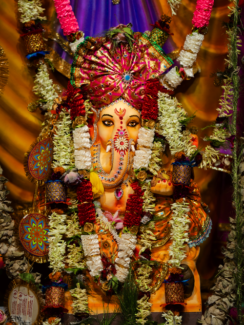 Free Colorful Ganesh idol decorated with traditional garlands in Kolkata, celebrating Ganesh Chaturthi. Stock Photo