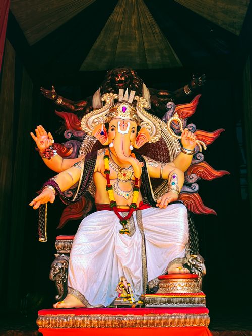 Free Vibrant Ganesha statue in outdoor setting, showcasing cultural richness in Satara, India. Stock Photo