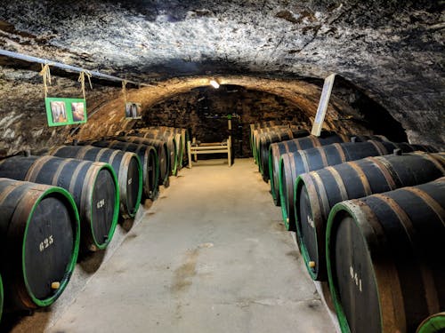 Brown Wooden Barrels In A Wine Cellar