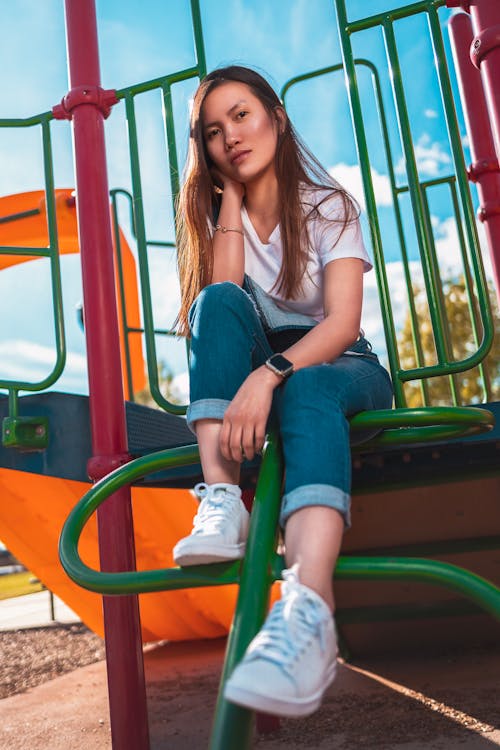 Free Woman In White Shirt At A Playground Stock Photo