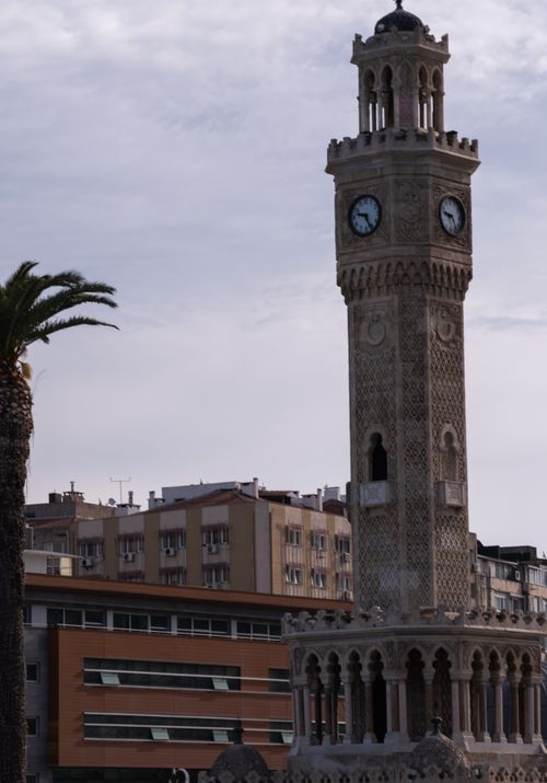 Free The iconic İzmir Clock Tower stands tall against a cloudy sky, epitomizing the historic beauty of İzmir, Türkiye. Stock Photo