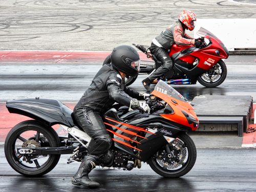 Free Two motorcyclists compete in a thrilling drag race at Haldimand, Ontario, Canada. Stock Photo