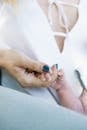 Soft focus of crop adorable newborn child hugging finger of young mother hand illustrating new family and baby protection concept