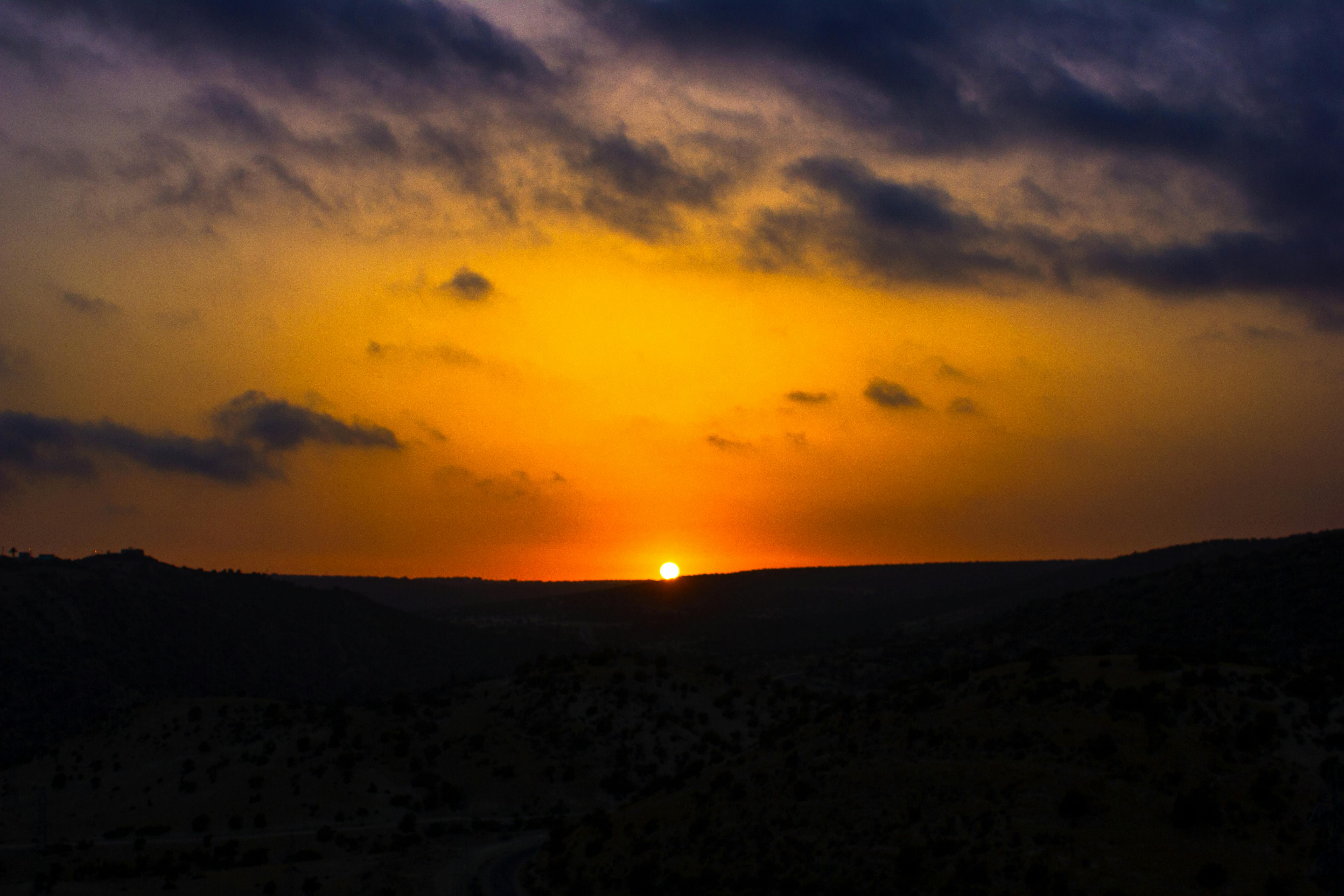 Image of person holding a finished cross stitch project