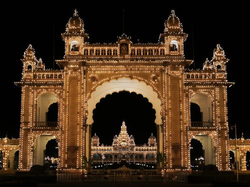 Free Stunning view of Mysore Palace beautifully lit up at night, showcasing intricate architecture and design. Stock Photo