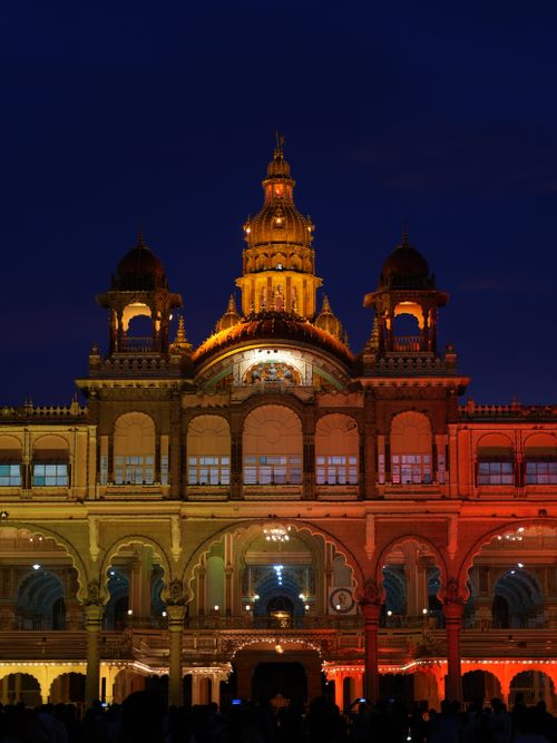 Free A stunning view of Mysore Palace illuminated at night, showcasing intricate architecture. Stock Photo